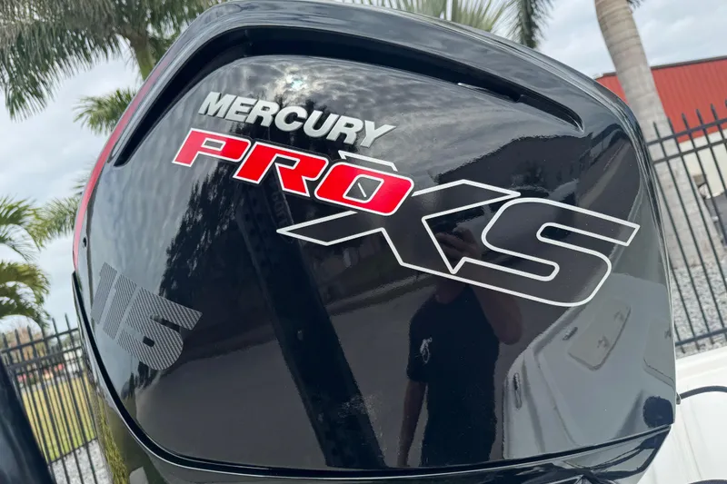 Slide: The Image of Mercury Pro XS engine on 2017 Mako Pro Skiff 19 CC boat, outdoor setting. - 9