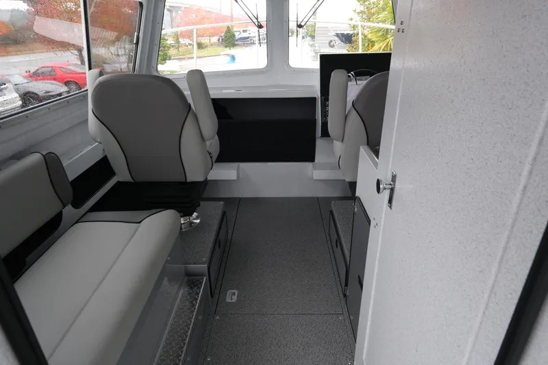 Slide: The Image of Interior of 2026 KingFisher 2825 Coastal Express boat, featuring modern seating and sleek design. - 10