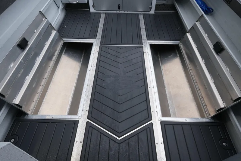 Slide: The Image of Interior view of 2026 KingFisher 2825 Coastal Express boat with open storage compartments. - 20