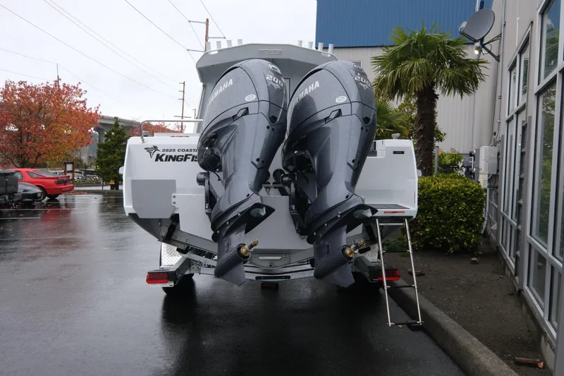 Slide: The Image of 2026 KingFisher 2825 Coastal Express boat with dual Yamaha outboard motors. - 5