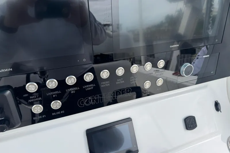 Slide: The Image of 2024 Contender 30 Tournament dashboard with Garmin displays and control buttons. - 16