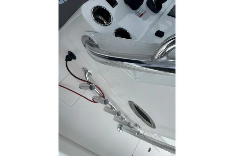 Slide: The Image of 2024 Contender 30 Tournament boat console with cup holders and stainless steel railings. - 18