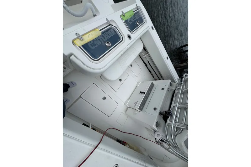Slide: The Image of 2024 Contender 30 Tournament boat interior with storage compartments and fishing equipment. - 20