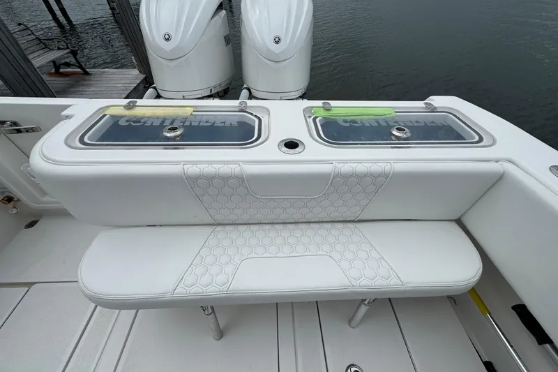 Slide: The Image of 2024 Contender 30 Tournament boat with dual engines and cushioned seating. - 22