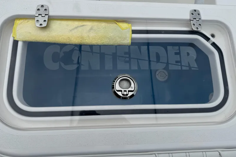 Slide: The Image of 2024 Contender 30 Tournament boat hatch with logo and latch. - 23