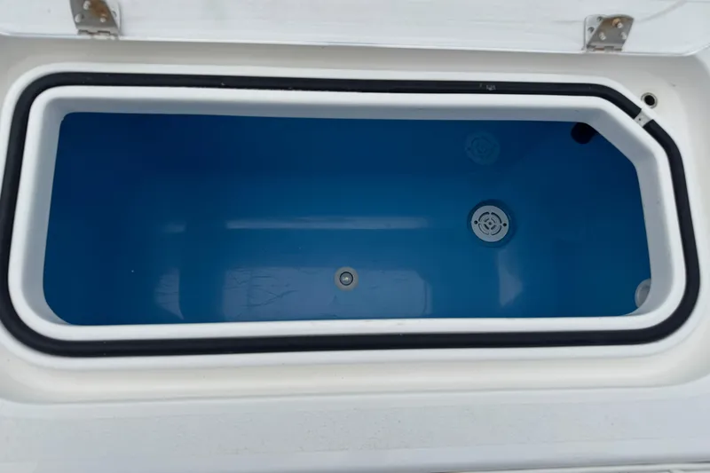 Slide: The Image of 2024 Contender 30 Tournament livewell with blue interior and drainage system. - 24