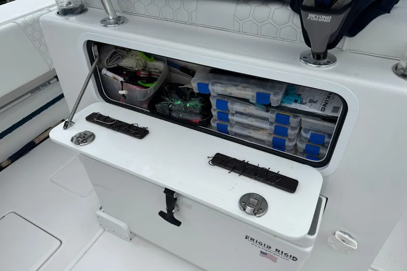 Slide: The Image of 2024 Contender 30 Tournament boat storage with organized fishing gear and tackle boxes. - 25