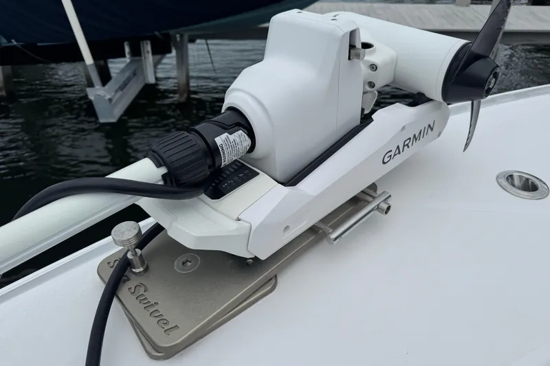Slide: The Image of Garmin trolling motor on 2024 Contender 30 Tournament boat, docked by water. - 28