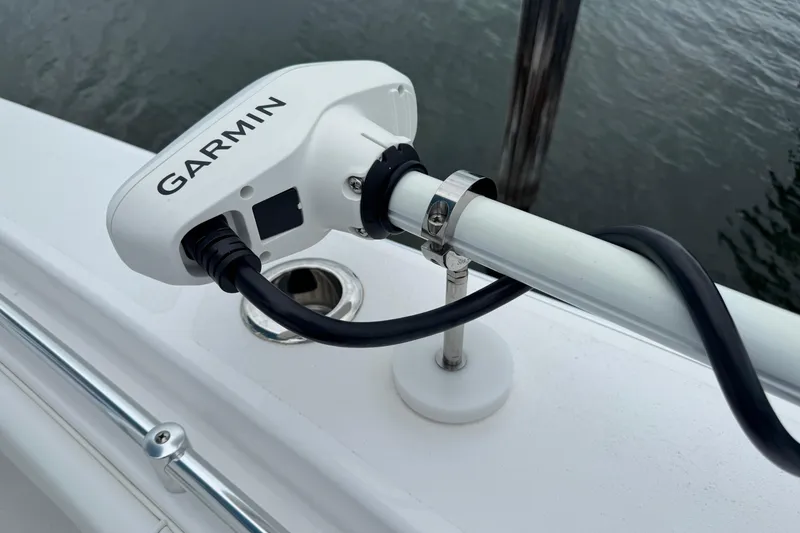 Slide: The Image of Garmin device mounted on 2024 Contender 30 Tournament boat, near water. - 29
