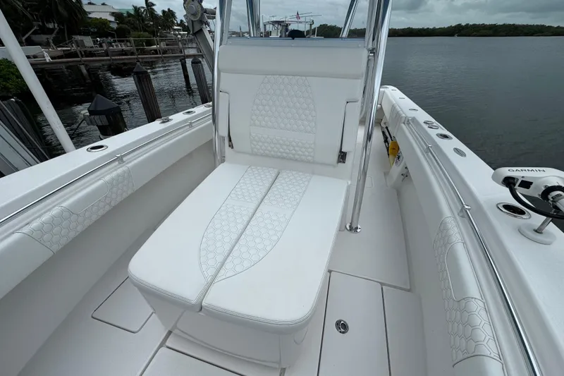 Slide: The Image of 2024 Contender 30 Tournament boat interior with white cushioned seating. - 30