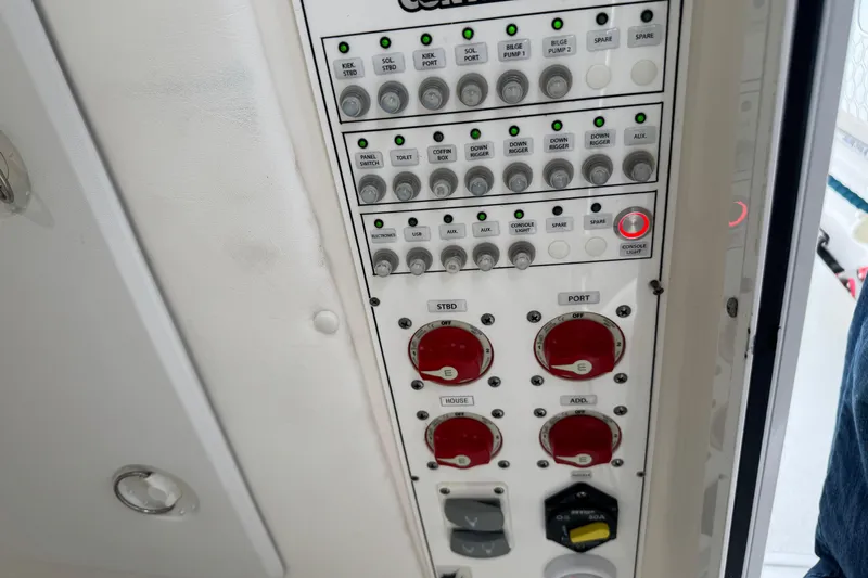 Slide: The Image of Control panel of 2024 Contender 30 Tournament boat with switches and indicators. - 34