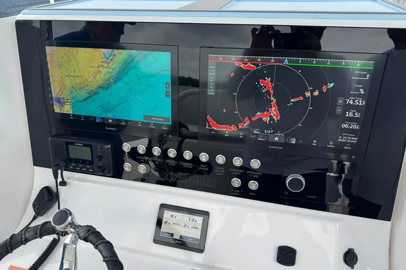Slide: The Image of Dashboard of 2024 Contender 30 Tournament boat with Garmin navigation displays. - 36