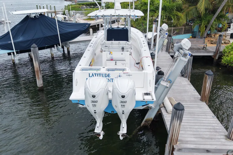 Slide: The Image of 2024 Contender 30 Tournament boat docked with dual 300 V6 engines. - 4