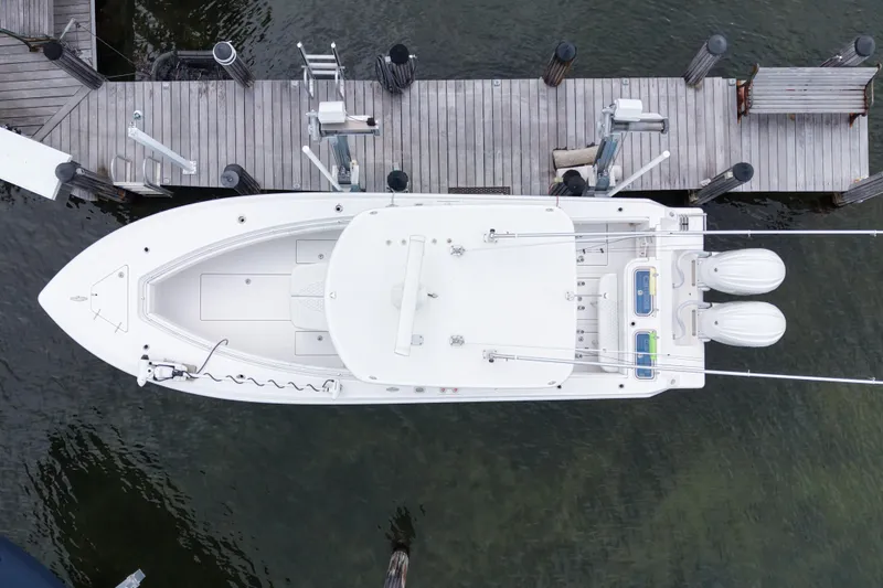 Slide: The Image of Aerial view of 2024 Contender 30 Tournament boat docked at a wooden pier. - 6