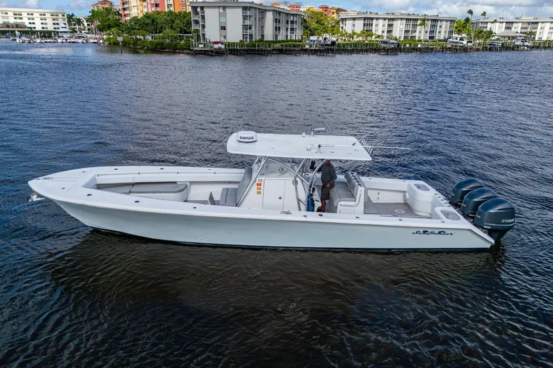 The Image of 2015 SeaHunter 37 Tournament boat on water, featuring triple Yamaha engines. - 0
