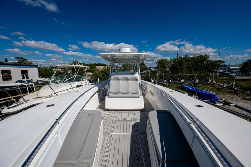 Slide: The Image of 2015 SeaHunter 37 Tournament boat with spacious deck and seating under a clear blue sky. - 19
