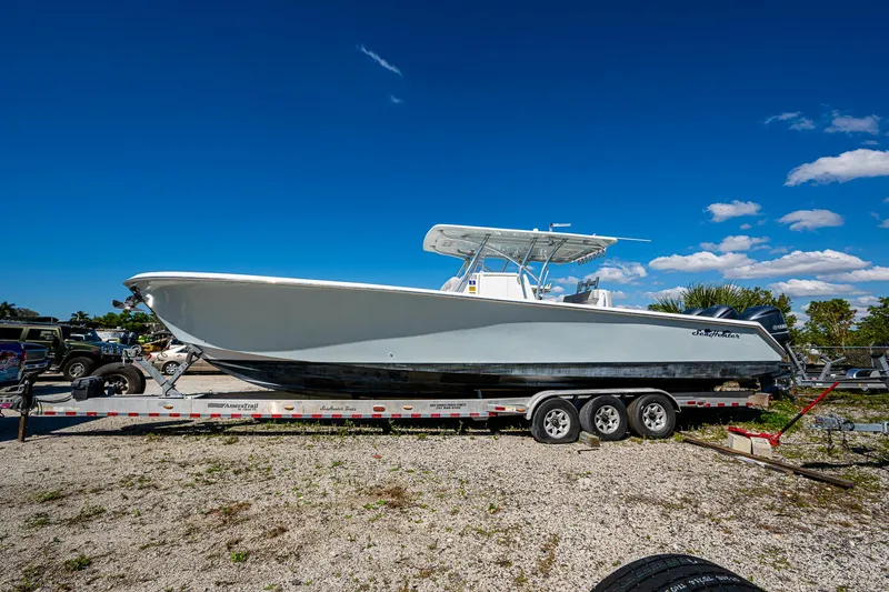 Slide: The Image of 2015 SeaHunter 37 Tournament boat on trailer under clear blue sky. - 2