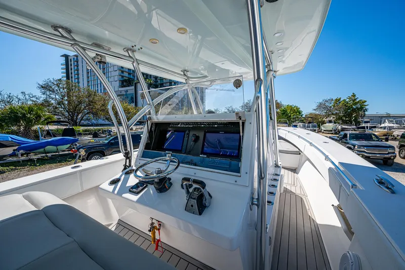 Slide: The Image of 2015 SeaHunter 37 Tournament boat cockpit with modern controls and seating. - 7