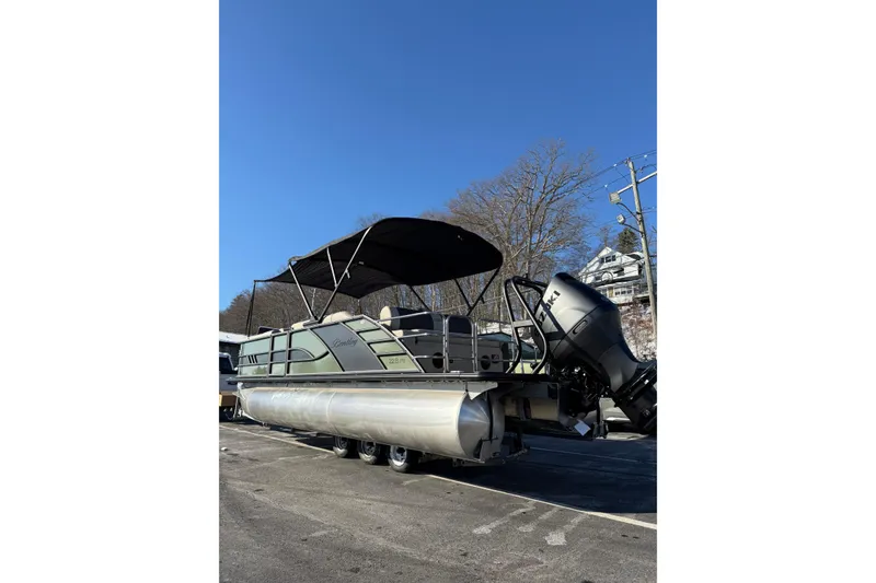 Slide: The Image of 2026 Bentley Pontoons Elite 223 Swingback Bench with powerful outboard motor. - 1