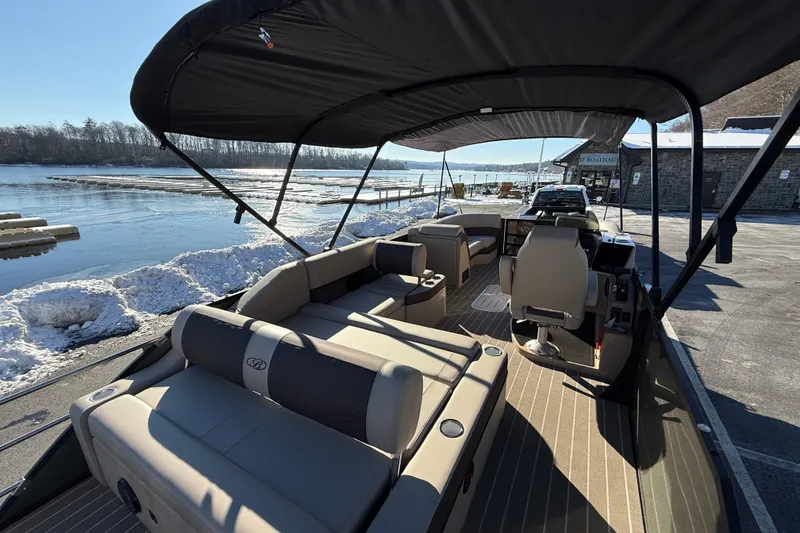 Slide: The Image of 2026 Bentley Pontoons Elite 223 Swingback Bench on snowy lakeside dock. - 4