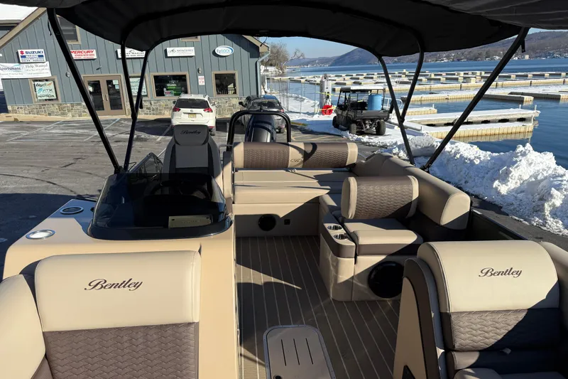 Slide: The Image of 2026 Bentley Pontoons Elite 223 Swingback Bench at snowy marina. - 6