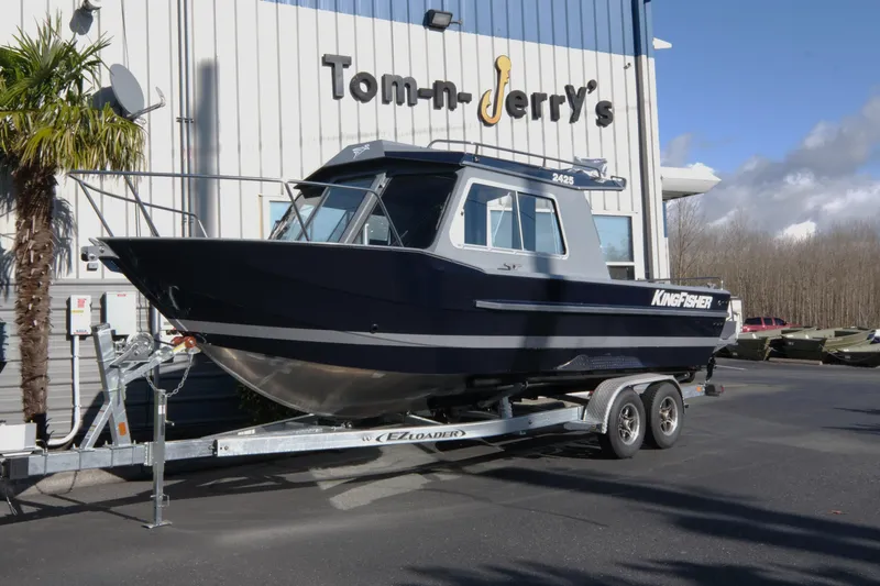 The Image of 2026 KingFisher 2425 Escape HT boat on trailer outside dealership. - 1