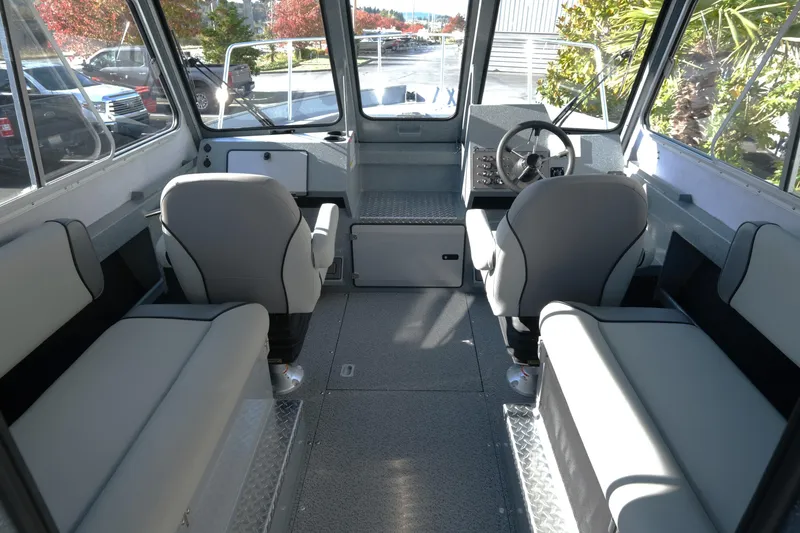 Slide: The Image of Interior of 2026 KingFisher 2425 Escape HT boat with modern seating and steering console. - 10