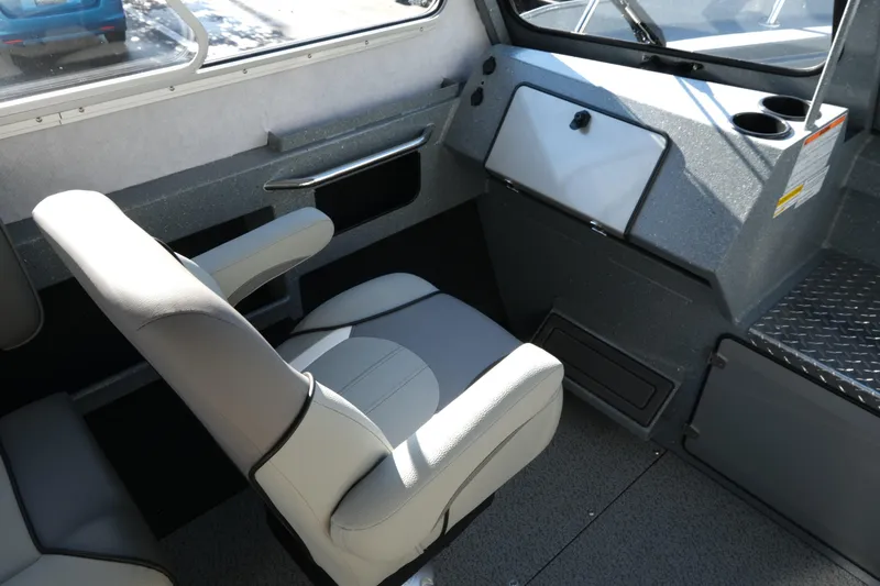 Slide: The Image of Interior of 2026 KingFisher 2425 Escape HT boat with seating and dashboard. - 15