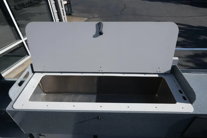 Slide: The Image of Open storage compartment on 2026 KingFisher 2425 Escape HT boat. - 21
