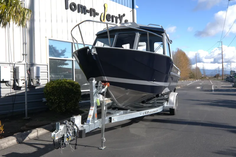 Slide: The Image of 2026 KingFisher 2425 Escape HT boat on trailer outside dealership. - 3