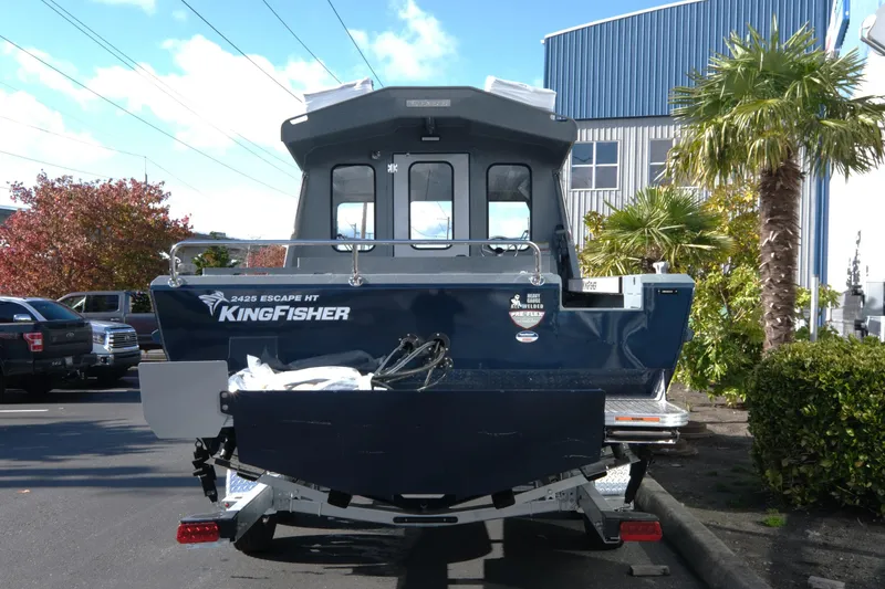 Slide: The Image of 2026 KingFisher 2425 Escape HT boat parked outdoors, rear view. - 5