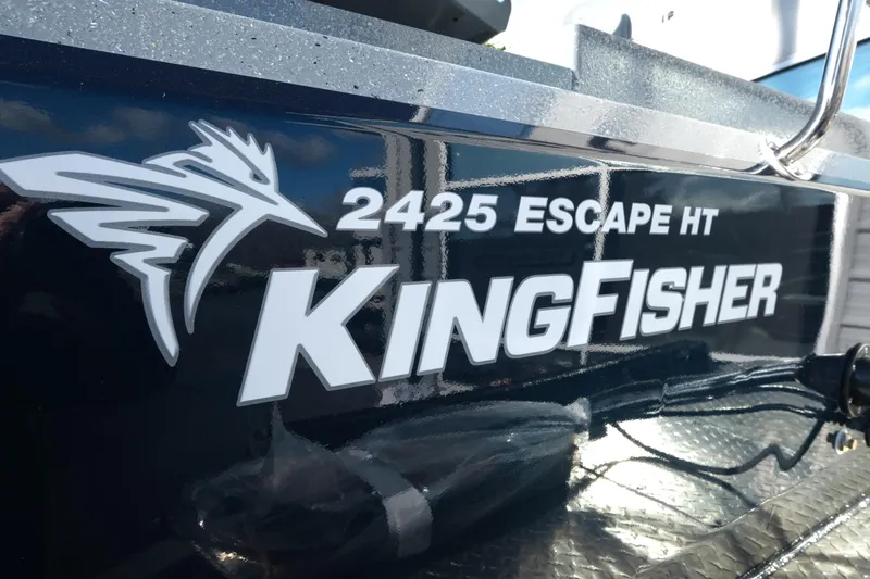 Slide: The Image of 2026 KingFisher 2425 Escape HT boat logo on dark surface. - 6