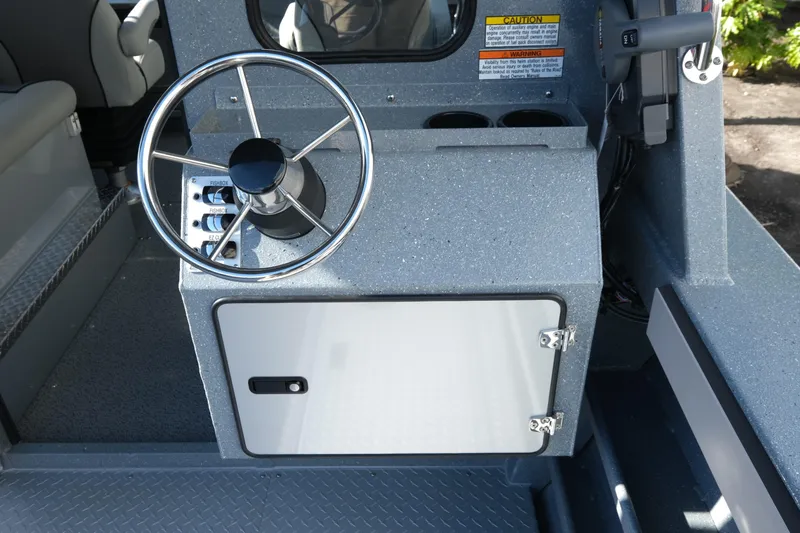 Slide: The Image of Steering console of 2026 KingFisher 2425 Escape HT boat, featuring modern controls and storage. - 9