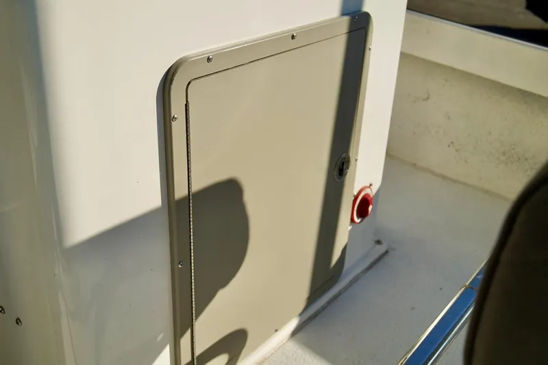 Slide: The Image of 1970 Aquasport 222 Flatback boat detail with storage compartment and red button. - 19