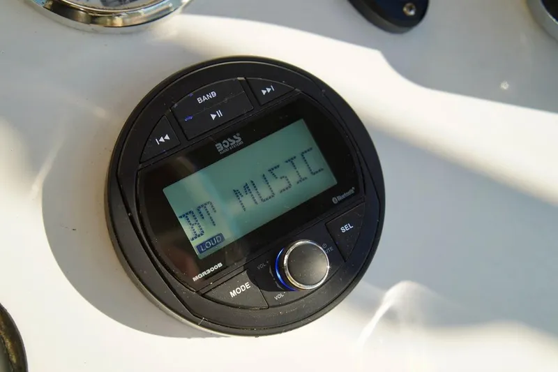 Slide: The Image of Audio system on 1970 Aquasport 222 Flatback boat displaying "BT MUSIC". - 17