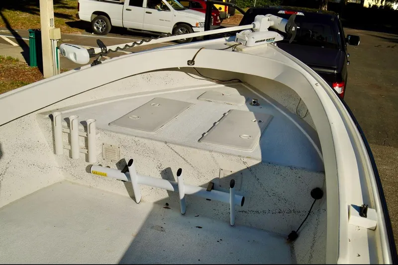 Slide: The Image of 1970 Aquasport 222 Flatback boat interior with rod holders and storage compartments. - 7