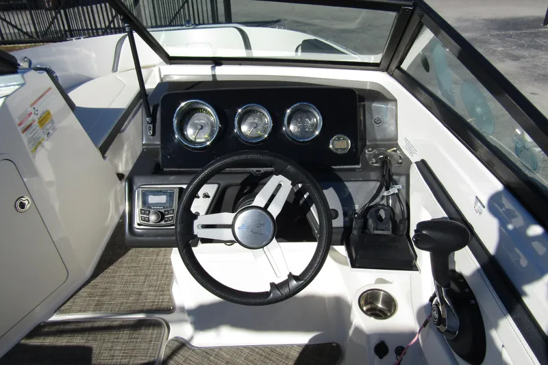 Slide: The Image of 2018 Sea Ray SPX 190 Outboard boat dashboard with steering wheel and controls. - 11