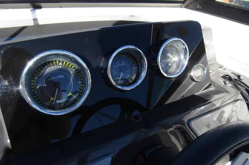Slide: The Image of Dashboard of 2018 Sea Ray SPX 190 Outboard with gauges and controls. - 13