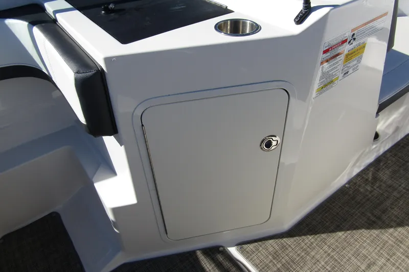 Slide: The Image of 2018 Sea Ray SPX 190 Outboard boat interior with storage compartment and cup holder. - 18