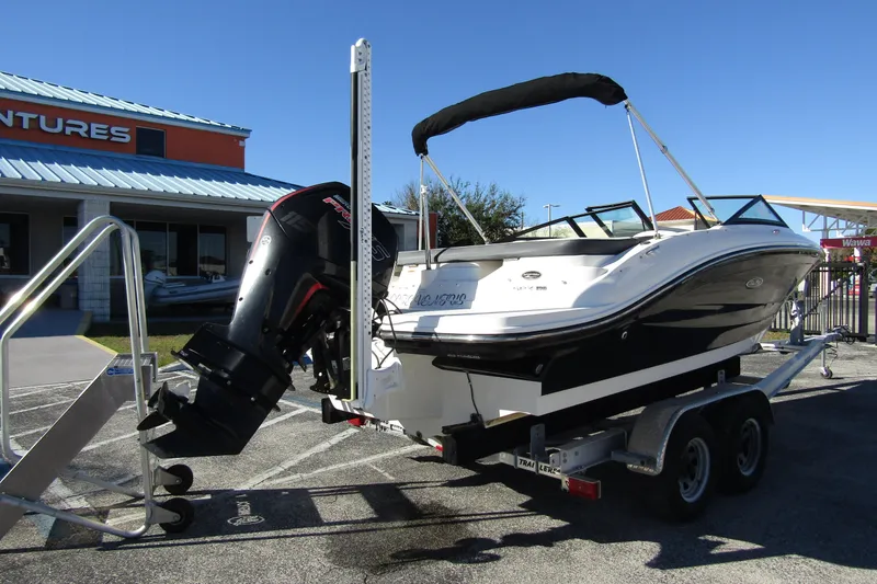 Slide: The Image of 2018 Sea Ray SPX 190 Outboard boat on trailer, displayed outdoors. - 2