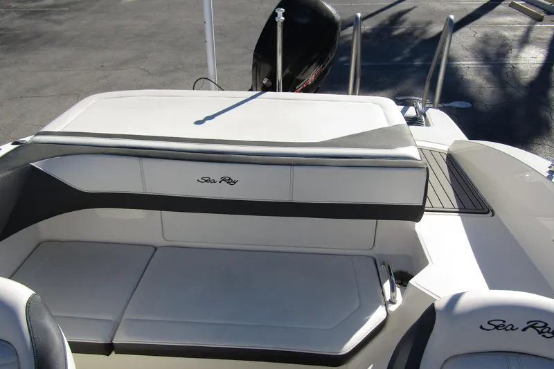 Slide: The Image of 2018 Sea Ray SPX 190 Outboard boat interior with seating and outboard motor. - 20