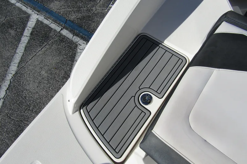 Slide: The Image of 2018 Sea Ray SPX 190 Outboard boat interior with sleek black and white seating. - 26