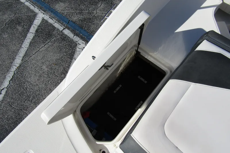 Slide: The Image of Open storage compartment on 2018 Sea Ray SPX 190 Outboard boat. - 27