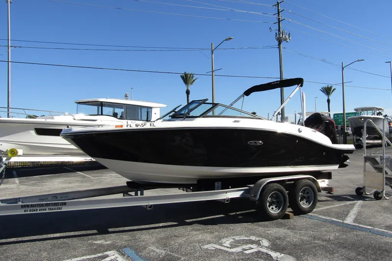 Slide: The Image of 2018 Sea Ray SPX 190 Outboard boat on trailer in parking lot. - 5