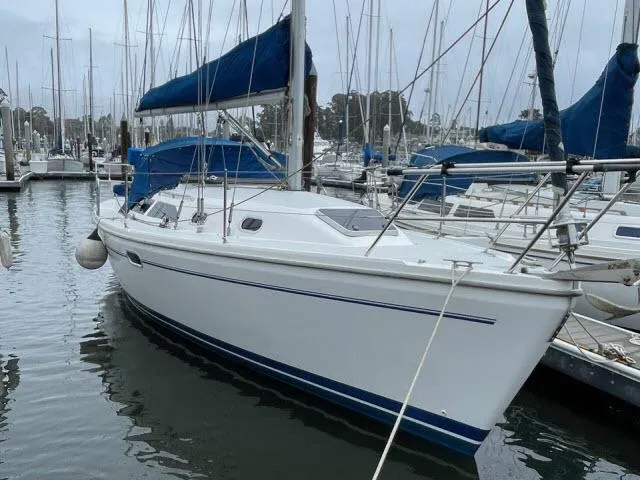 The Image of 2000 Catalina 310 sailboat docked in marina. - 1