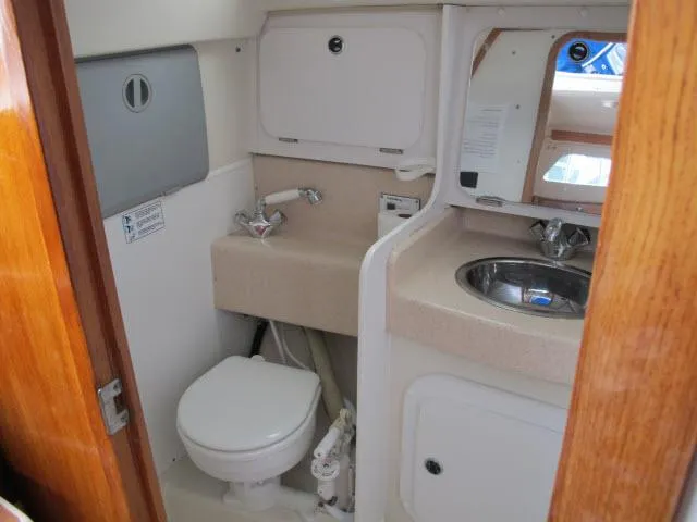 Slide: The Image of Interior of 2000 Catalina 310 yacht bathroom. - 14