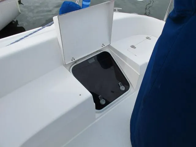 Slide: The Image of Open storage compartment on a 2000 Catalina 310 boat. - 21