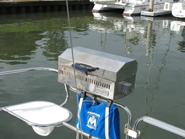 Slide: The Image of Propane grill on Catalina 310 sailboat, year 2000, by the water. - 24