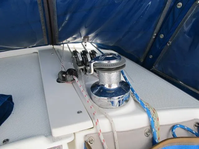 Slide: The Image of Deck view of a 2000 Catalina 310 yacht with winch and ropes. - 27