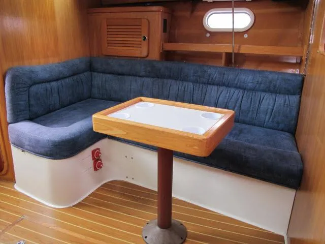 Slide: The Image of Interior of a 2000 Catalina 310 yacht with blue upholstery. - 3